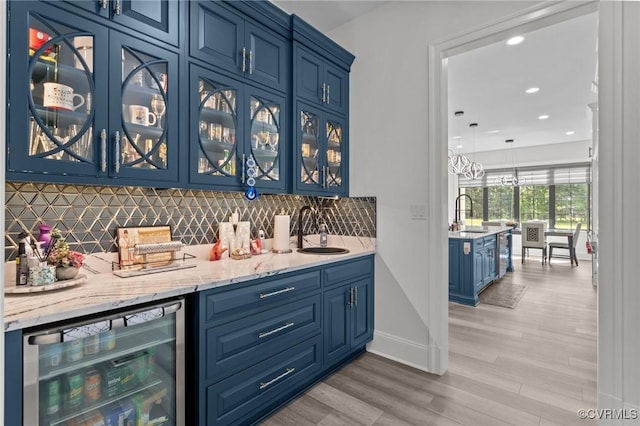 12313 Haybrook Ln, Henrico, VA 23059 - indoor wet bar with wine cooler, backsplash, light wood-style floors, and recessed lighting