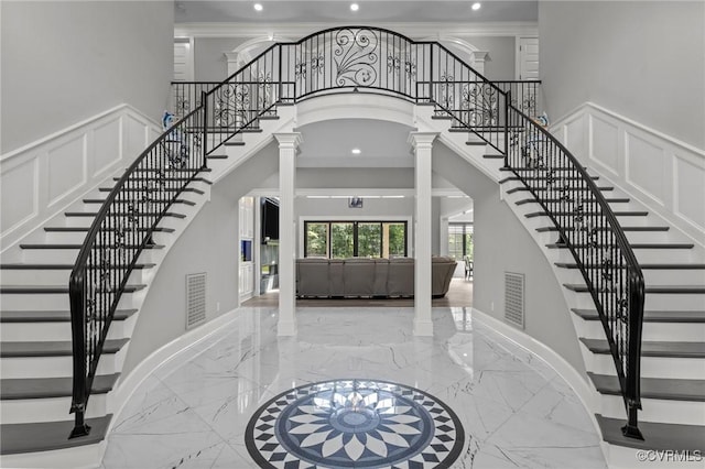 12313 Haybrook Ln, Henrico, VA 23059 - entrance foyer featuring marble tiled flooring, ornate columns, stairway, recessed lighting, and a high ceiling