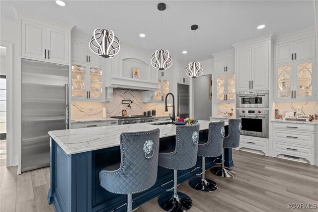 12313 Haybrook Ln, Henrico, VA 23059 - kitchen featuring stainless steel built in fridge, backsplash, white cabinetry, glass insert cabinets, and recessed lighting