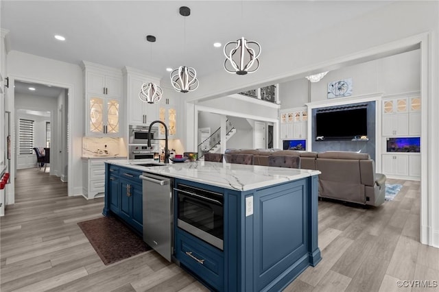 12313 Haybrook Ln, Henrico, VA 23059 - kitchen featuring blue cabinets, appliances with stainless steel finishes, white cabinetry, light wood-style flooring, and recessed lighting