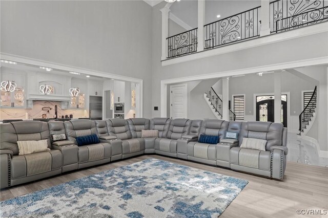 12313 Haybrook Ln, Henrico, VA 23059 - cinema featuring a high ceiling, wood finished floors, and decorative columns