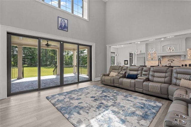 12313 Haybrook Ln, Henrico, VA 23059 - living area with a towering ceiling, a ceiling fan, and light wood-type flooring