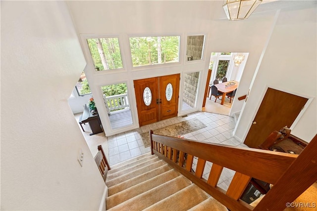 4604 Chesdin Woods Dr, Sutherland, Sutherland, VA 23885 - tiled entryway featuring plenty of natural light, a towering ceiling, and stairs