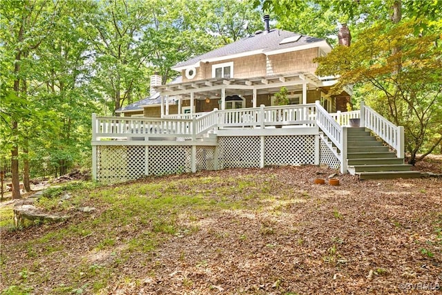 4604 Chesdin Woods Dr, Sutherland, Sutherland, VA 23885 - back of house with stairway, a deck, a shingled roof, a chimney, and a pergola