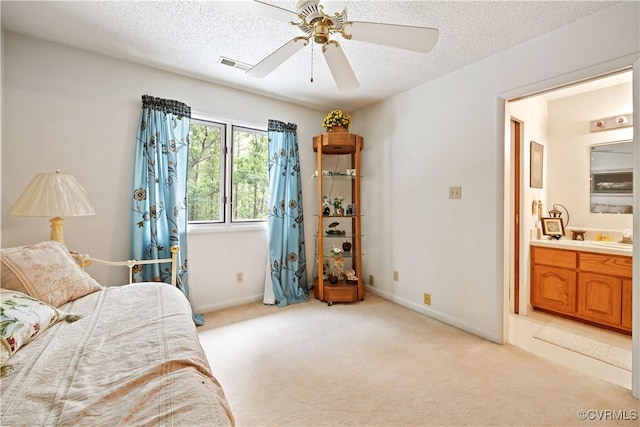 4604 Chesdin Woods Dr, Sutherland, Sutherland, VA 23885 - bedroom featuring light colored carpet, a textured ceiling, connected bathroom, and ceiling fan