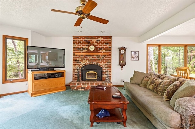 4604 Chesdin Woods Dr, Sutherland, Sutherland, VA 23885 - living area featuring a textured ceiling, healthy amount of natural light, carpet floors, a ceiling fan, and a brick fireplace