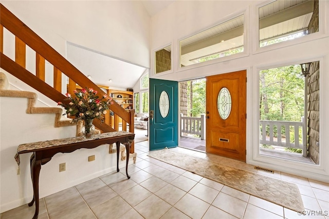 4604 Chesdin Woods Dr, Sutherland, Sutherland, VA 23885 - foyer entrance featuring stairway, healthy amount of natural light, high vaulted ceiling, and light tile patterned floors