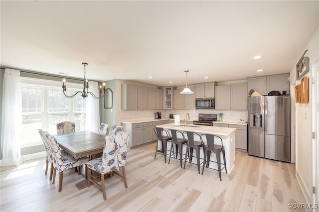 8851 Topeka Rd, Quinton, VA 23141 - dining space with light wood finished floors, recessed lighting, and a chandelier