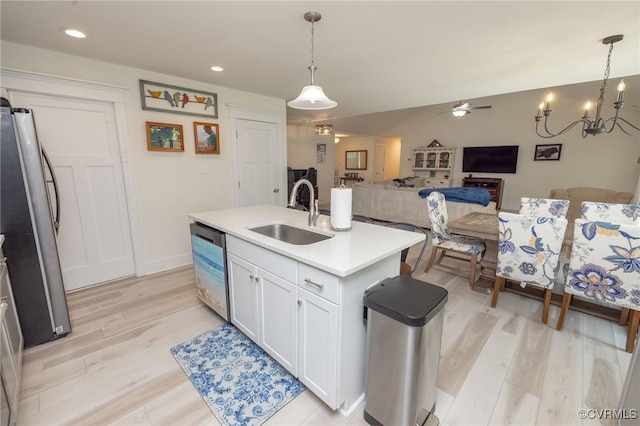 8851 Topeka Rd, Quinton, VA 23141 - kitchen featuring appliances with stainless steel finishes, light wood-type flooring, white cabinetry, open floor plan, and light countertops