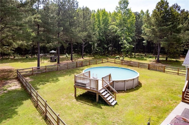 8851 Topeka Rd, Quinton, VA 23141 - view of pool with a fenced backyard, a deck, stairway, and view of scattered trees