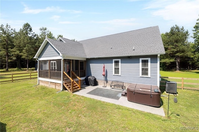 8851 Topeka Rd, Quinton, VA 23141 - rear view of property featuring a sunroom, a hot tub, a patio, and a shingled roof
