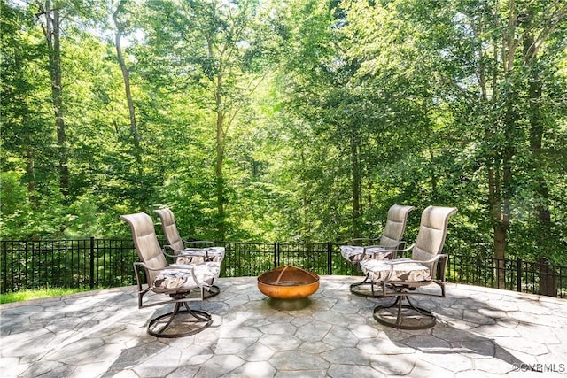 2631 Royal Crest Dr, Midlothian, VA 23113 - view of patio with a fire pit and a view of trees