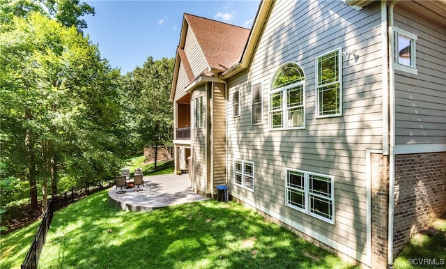 2631 Royal Crest Dr, Midlothian, VA 23113 - view of side of property featuring a patio area, a lawn, and brick siding
