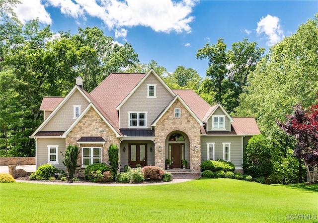 2631 Royal Crest Dr, Midlothian, VA 23113 - craftsman-style home featuring stone siding, french doors, and a front yard