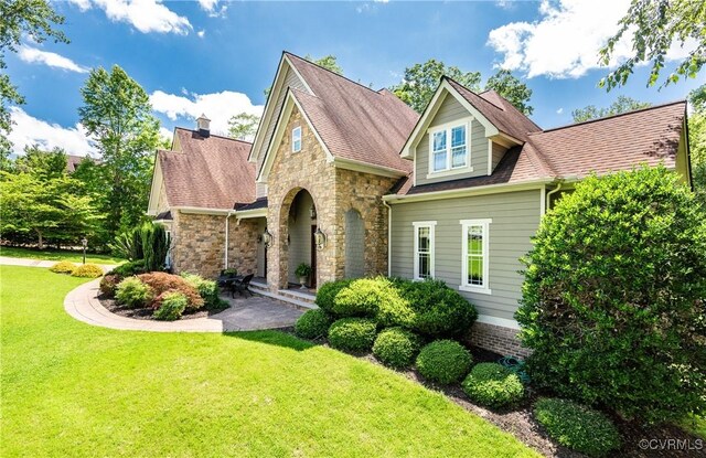 2631 Royal Crest Dr, Midlothian, VA 23113 - view of front of house with a front lawn, stone siding, and a shingled roof