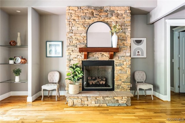 2631 Royal Crest Dr, Midlothian, VA 23113 - living room featuring wood finished floors and a fireplace with raised hearth