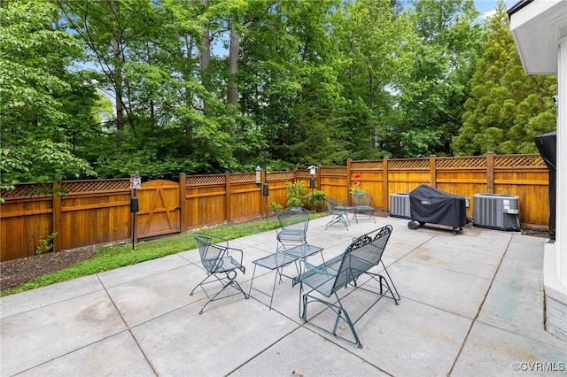 9522 Nassington Ct, Henrico, VA 23229 - fenced backyard with a patio, a gate, area for grilling, and outdoor dining space