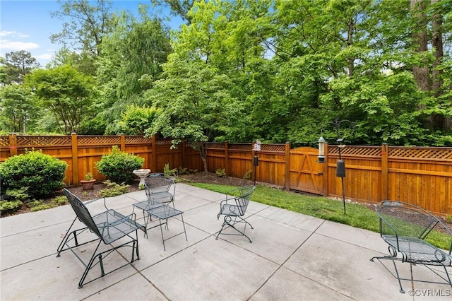 9522 Nassington Ct, Henrico, VA 23229 - fenced backyard featuring a patio and view of wooded area
