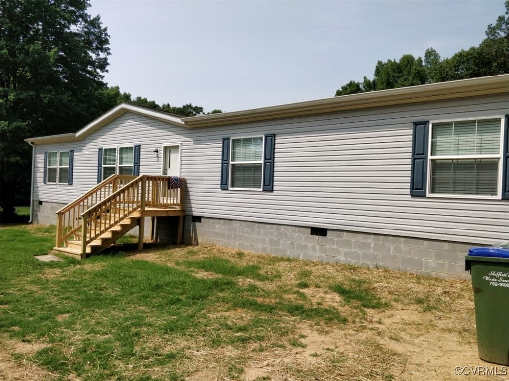 218 Cropp Rd, Fredericksburg, VA 22406 - back of property with crawl space and a lawn