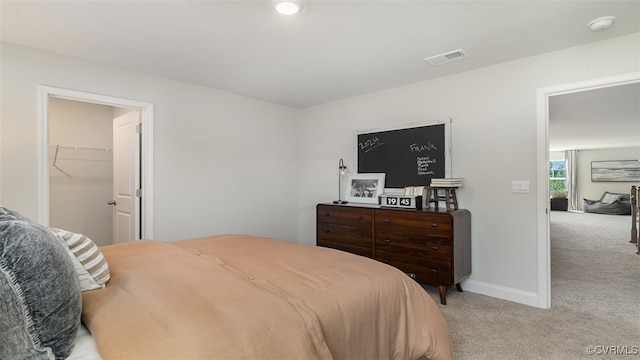 7007 Greenholm Pl, Chesterfield, VA 23234 - bedroom featuring light colored carpet and a walk in closet