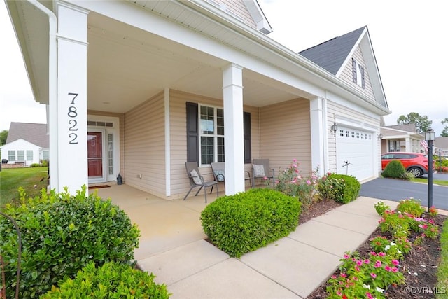 7822 James Blair Ln, New Kent, VA 23124 - view of exterior entry featuring a porch and driveway