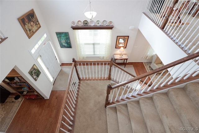 7822 James Blair Ln, New Kent, VA 23124 - foyer entrance with a towering ceiling, stairs, and wood finished floors