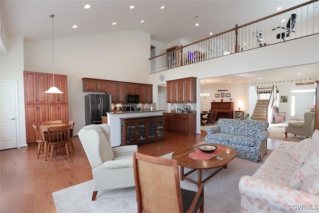 7822 James Blair Ln, New Kent, VA 23124 - living area with high vaulted ceiling, light wood-style flooring, stairs, and recessed lighting