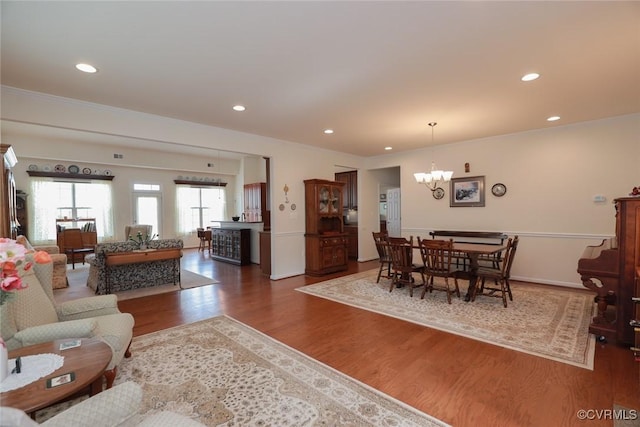7822 James Blair Ln, New Kent, VA 23124 - living area with a chandelier, wood finished floors, and recessed lighting