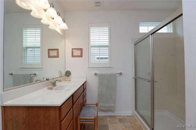 7822 James Blair Ln, New Kent, VA 23124 - bathroom with vanity, a shower with door, and a chandelier