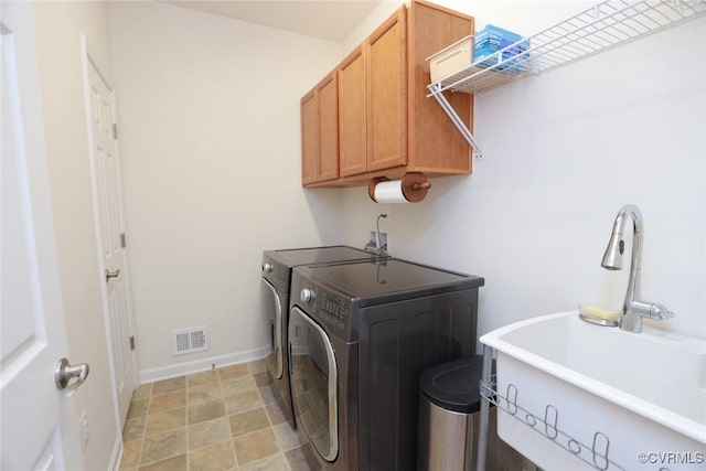 7822 James Blair Ln, New Kent, VA 23124 - washroom featuring separate washer and dryer and cabinet space
