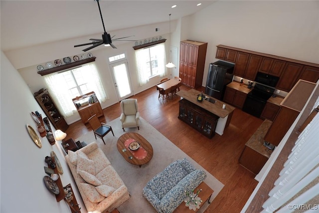 7822 James Blair Ln, New Kent, VA 23124 - living room with wood finished floors, high vaulted ceiling, and a ceiling fan
