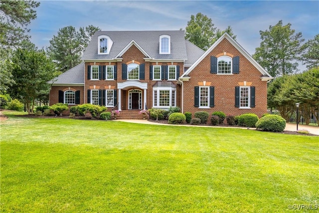 2619 Mulberry Row Rd, Midlothian, VA 23113 - colonial-style house featuring brick siding and a front yard