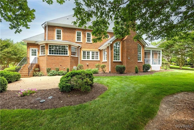 2619 Mulberry Row Rd, Midlothian, VA 23113 - view of front of home with a sunroom, brick siding, and a front lawn