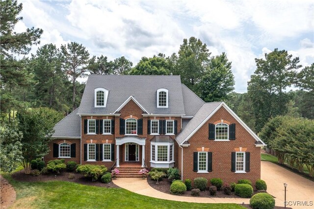 2619 Mulberry Row Rd, Midlothian, VA 23113 - colonial inspired home featuring brick siding, a front lawn, and concrete driveway