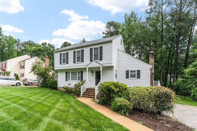 1917 Moonwind Pl, Henrico, VA 23238 - view of front of home featuring a front lawn and a chimney