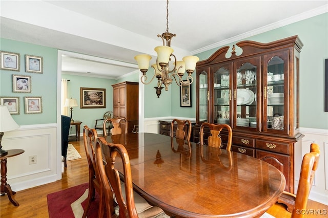 1917 Moonwind Pl, Henrico, VA 23238 - dining area with a chandelier, ornamental molding, wood finished floors, wainscoting, and a decorative wall