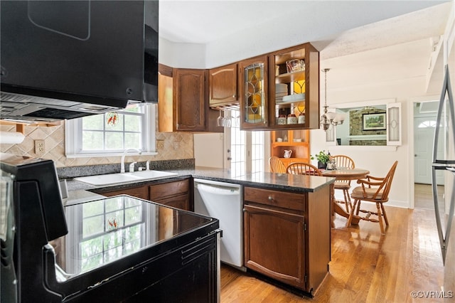1917 Moonwind Pl, Henrico, VA 23238 - kitchen featuring white dishwasher, dark countertops, a peninsula, and light wood-style floors