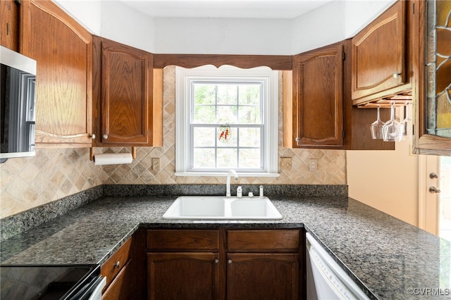 1917 Moonwind Pl, Henrico, VA 23238 - kitchen with dark countertops, tasteful backsplash, and white dishwasher