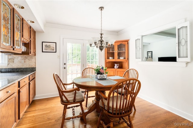 1917 Moonwind Pl, Henrico, VA 23238 - dining room with a chandelier, light wood finished floors, and ornamental molding