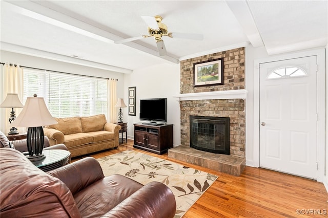 1917 Moonwind Pl, Henrico, VA 23238 - living area featuring light wood-type flooring, ceiling fan, a fireplace, and beamed ceiling
