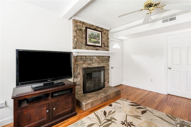 1917 Moonwind Pl, Henrico, VA 23238 - living area with light wood finished floors, beam ceiling, a fireplace, and ceiling fan