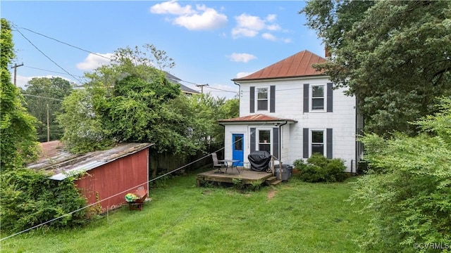 104 E 5th St, Mineral, VA 23117 - rear view of house with a standing seam roof, a wooden deck, a lawn, and a metal roof