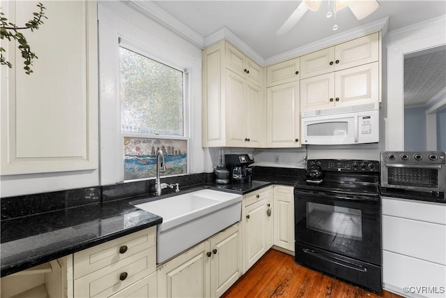 104 E 5th St, Mineral, VA 23117 - kitchen featuring white microwave, electric range, dark wood-style floors, crown molding, and dark stone counters