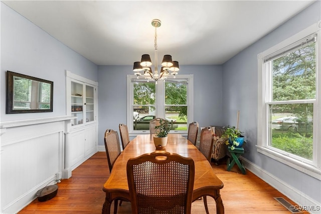 104 E 5th St, Mineral, VA 23117 - dining room featuring a chandelier, plenty of natural light, and wood finished floors