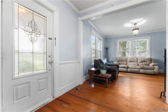 104 E 5th St, Mineral, VA 23117 - entrance foyer featuring wood finished floors, ornamental molding, and wainscoting