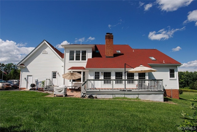 2104 Apple Grove Rd, Mineral, VA 23117 - rear view of house featuring a chimney, a yard, a wooden deck, and a patio area