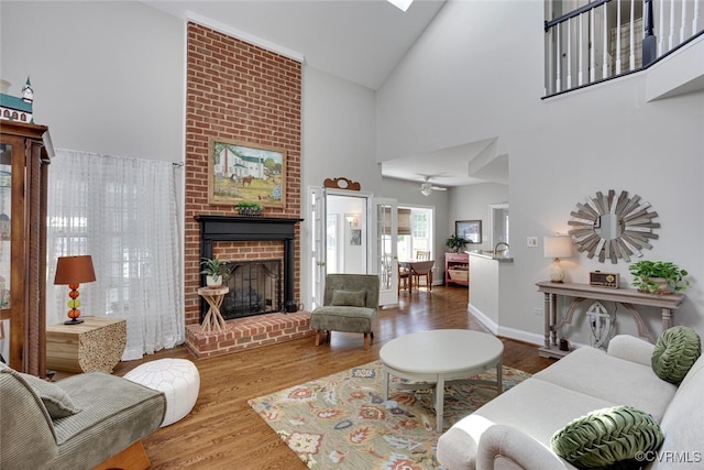 2104 Apple Grove Rd, Mineral, VA 23117 - living room featuring a brick fireplace, high vaulted ceiling, wood finished floors, and ceiling fan
