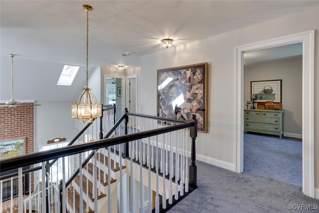 2104 Apple Grove Rd, Mineral, VA 23117 - hall featuring a skylight, an upstairs landing, a chandelier, and carpet