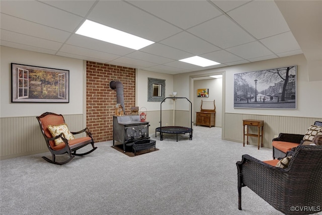 2104 Apple Grove Rd, Mineral, VA 23117 - sitting room with a wood stove, a drop ceiling, carpet flooring, and a wainscoted wall