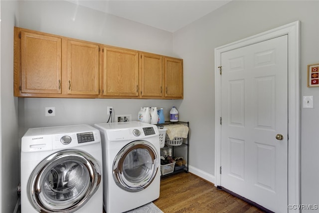 2104 Apple Grove Rd, Mineral, VA 23117 - laundry area with cabinet space, wood finished floors, and washing machine and dryer
